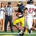 Michigan senior quarterback Denard Robinson scores a touchdown past UMass safety Darren Thellen in the second quarter against UMass at Michigan Stadium on Saturday. Melanie Maxwell I AnnArbor.com